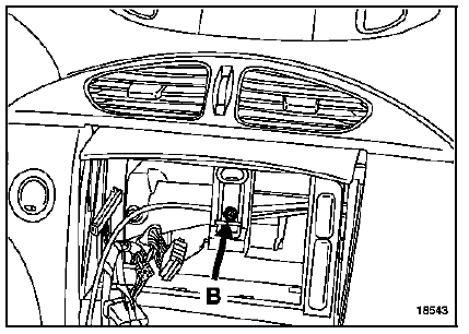 Déposer la vis de fixation de planche de bord (B).